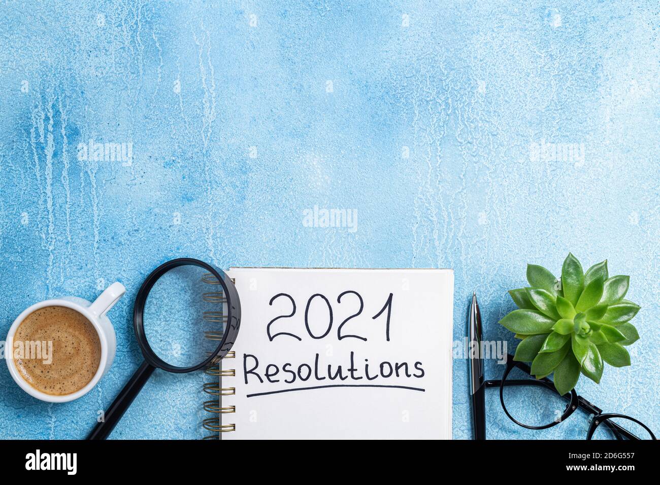 New year resolutions 2021 on desk. 2021 goals with notebook, coffee cup ...