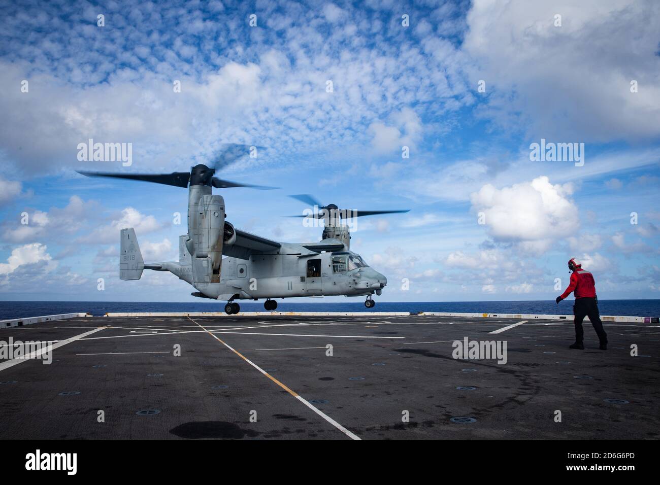 PHILIPPINE SEA (Aug. 24, 2020) A MV22B Tiltrotor aircraft with Marine Medium Tiltrotor Squadron 262 (Reinforced), 31st Marine Expeditionary Unit (MEU), prepares to land on USS New Orleans (LPD 18).  New Orleans part of the America Amphibious Ready Group (ARG), 31st MEU team, is operating in the U.S. 7th Fleet area of operation to enhance interoperability with allies and partners and serve as a ready response force to defend peace and stability in the Indo-Pacific region. The America ARG, 31st MEU team remains the premier crisis response force in the region despite the unique challenges caused Stock Photo