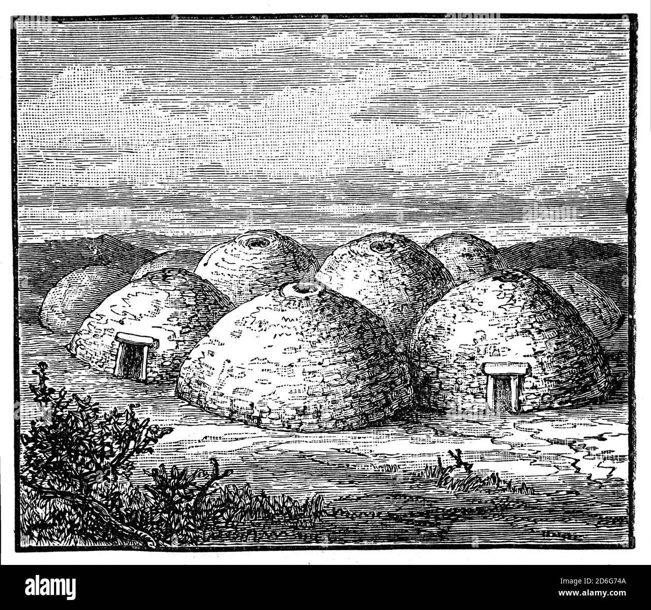 A clochán, or beehive huts, dry-stone buildings with a corbelled roof, commonly associated with the south-western Irish seaboard. The precise construction date of most of these structures is unknown with the buildings belonging to a long-established Celtic tradition, though there is at present no direct evidence to date the surviving examples before the first century AD. Many occur in religious contexts such as used by the monks following Saint Patrick. Stock Photo