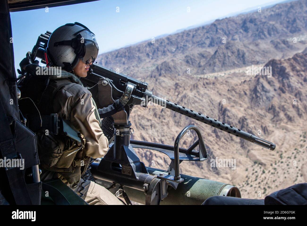 U.S. Marine Corps Lance Cpl. Angel Hernandez, aircrewman, Marine Light Attack Helicopter Squadron 169, Marine Aircraft Group 16, 3rd Marine Aircraft Wing, scans for targets from a U.S. Marine Corps Bell UH-1Y Venom during Integrated Training Exercise 1-21 at Marine Corps Air Ground Combat Center, Twentynine Palms, California, Oct. 2, 2020. ITX is the most comprehensive training conducted at MCAGCC and focuses on the tactical application of combined-arms maneuver, offensive and defensive operations during combat. (U.S. Marine Corps photo by Lance Cpl. Joshua Sechser) Stock Photo