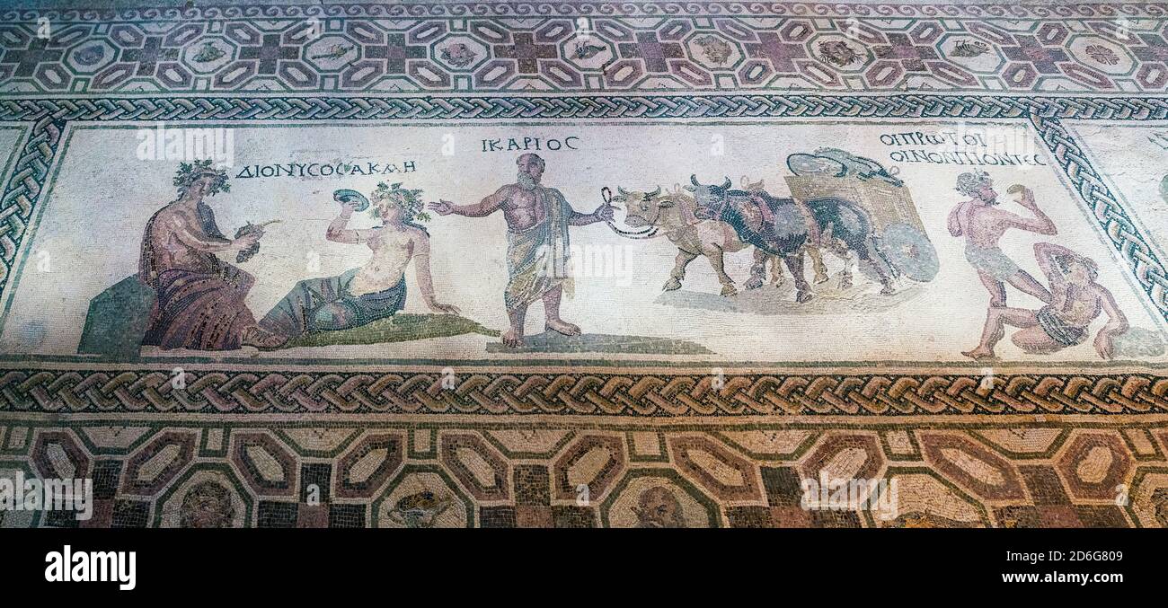 House of Dionysos: Dionysos & Acme are depicted (left) with Icarios holding the reins of an ox-driven double wheeled cart, filled with sacks of wine. Stock Photo