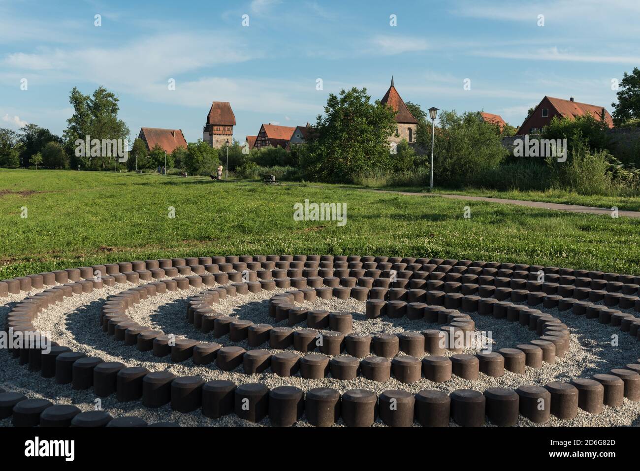Cityscape background of Dinkelsbuhl, Germany, an old historic town with spiral pathway for exercise in foreground. Stock Photo