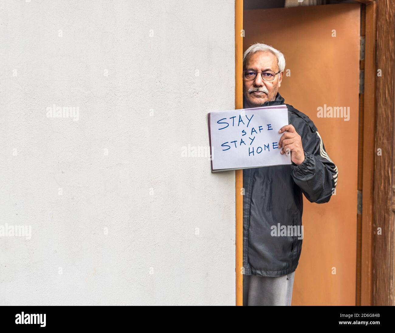 Covid19 pandemic lock down in lucknow,India, a senior citizen braving home quarantine appealing to Stay safe,Stay Home on 12-May,2020. Stock Photo