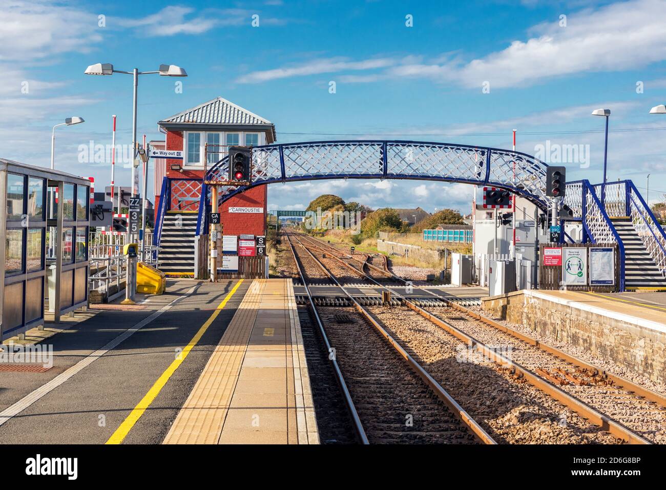 Carnoustie railway station with iron footbridge and old fashioned