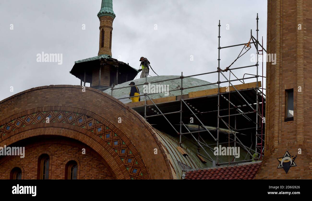 Employees from Dunmore roofing on the Irem Temple dome in WilkesBarre.The Irem Temple has