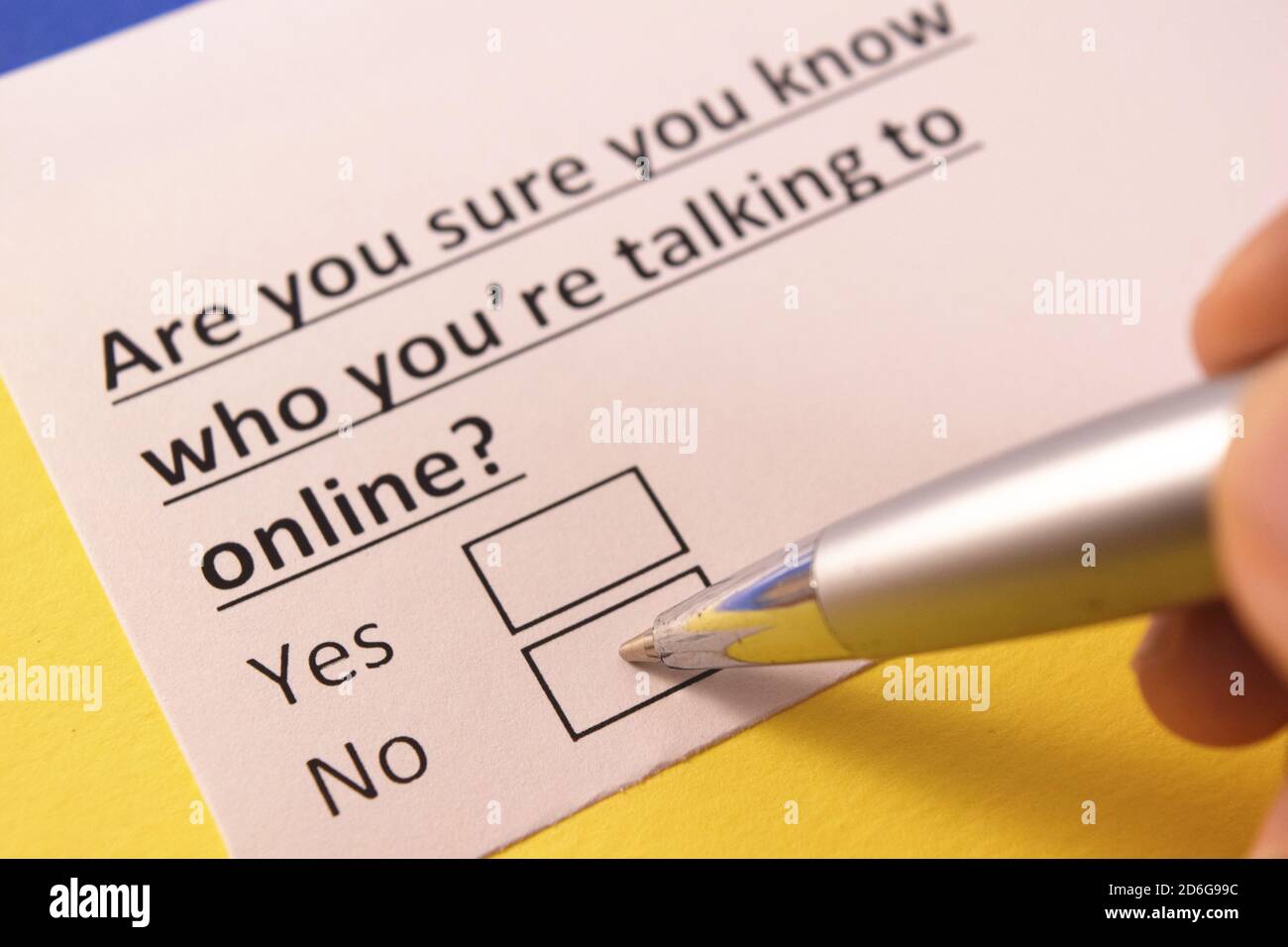Are you sure you know who you're talking to online? Yes or no? Stock Photo