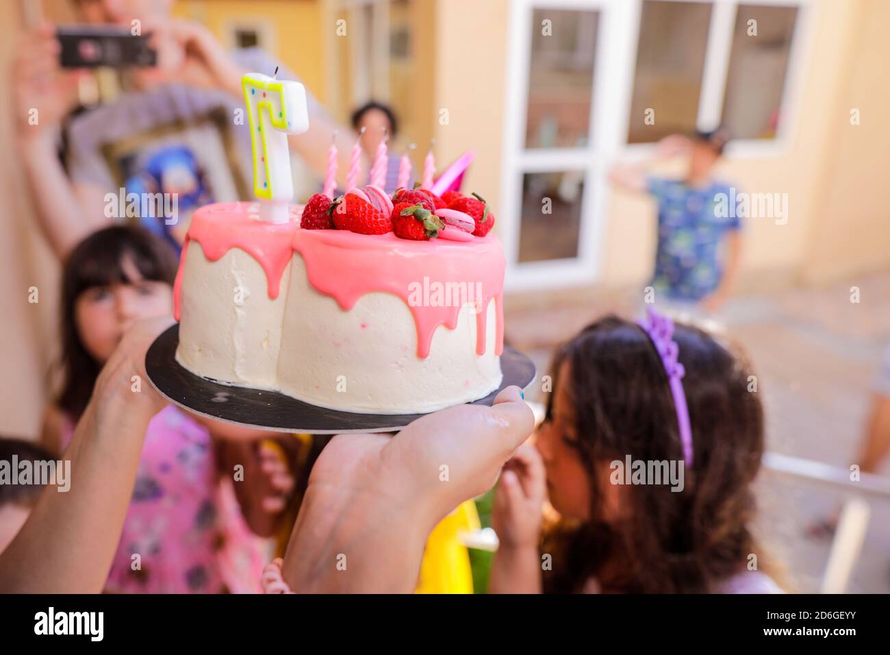 Shallow depth of field (selective focus) image with a red berries birthday cake for a little girl. Stock Photo