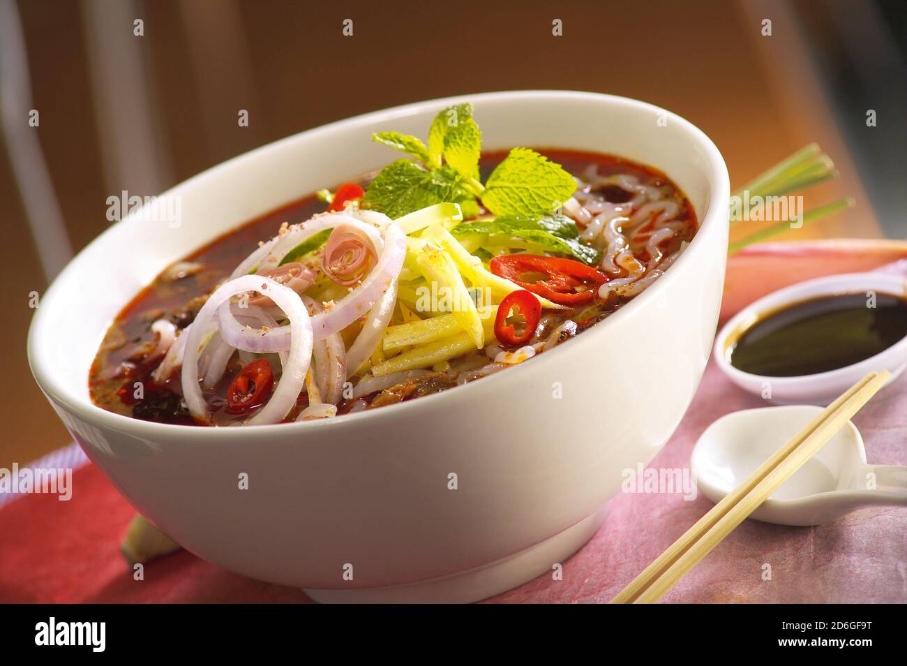 Asam Laksa, a flavorful, tangy and spicy Malaysian fish based rice noodle soup Stock Photo
