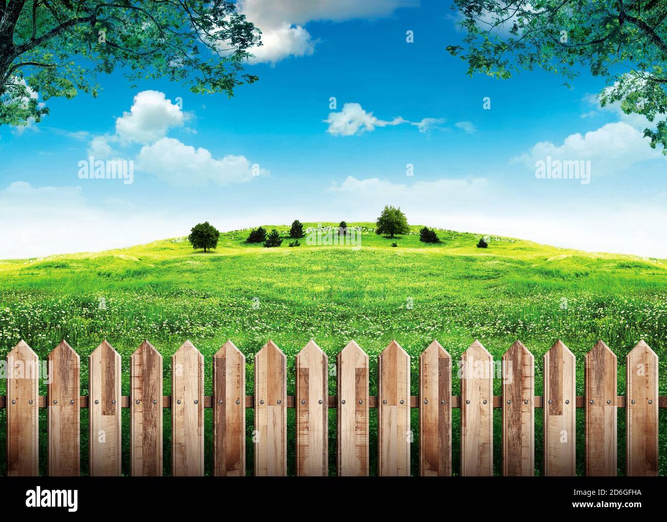 Wooden fence in green field and blue sky with clouds Stock Photo - Alamy