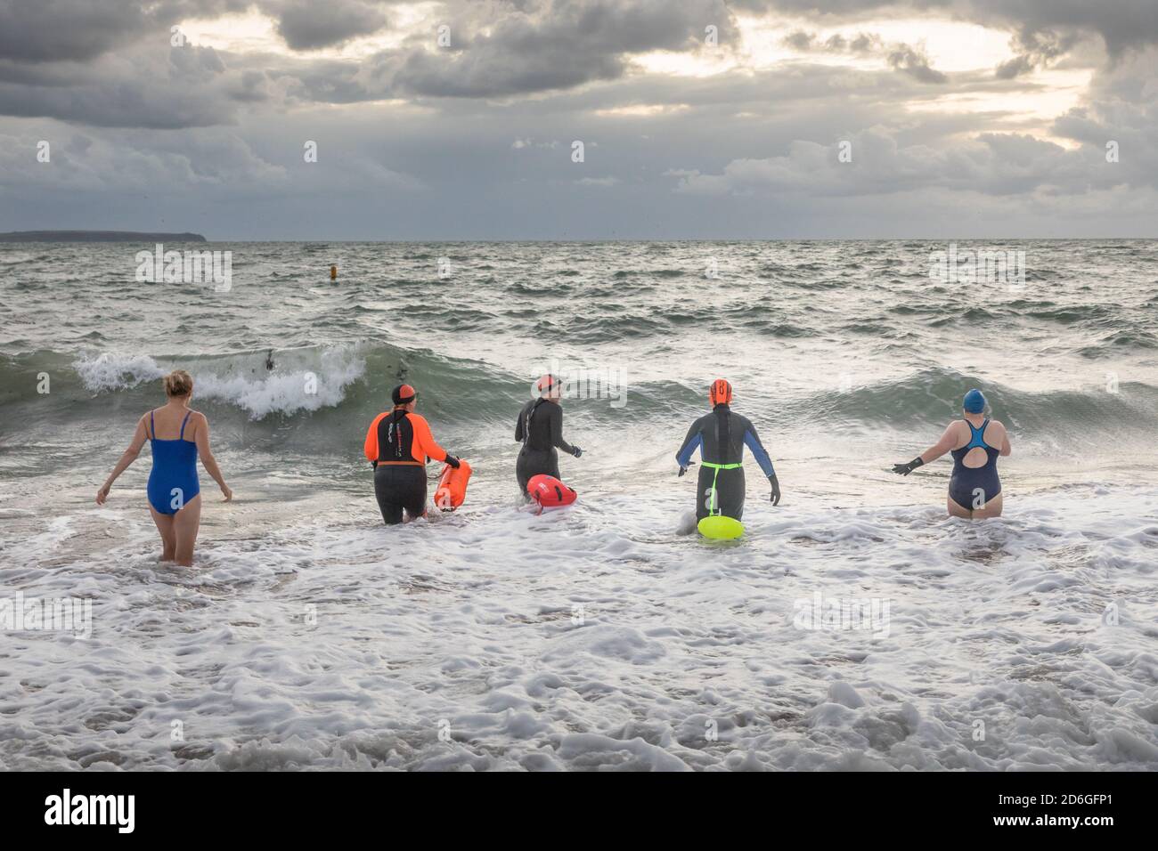 Myrtleville, Cork, Ireland. 17th October, 2020. Sunrise swimmers Dolores Mahony, Eilis O'Keffee, Niamh Cutbert, Claire Levis and Pamela Coniry going for a dawn dip in the cold sea at Myrtleville, Co. Cork, Ireland. - Credit; David Creedon / Alamy Live News Stock Photo