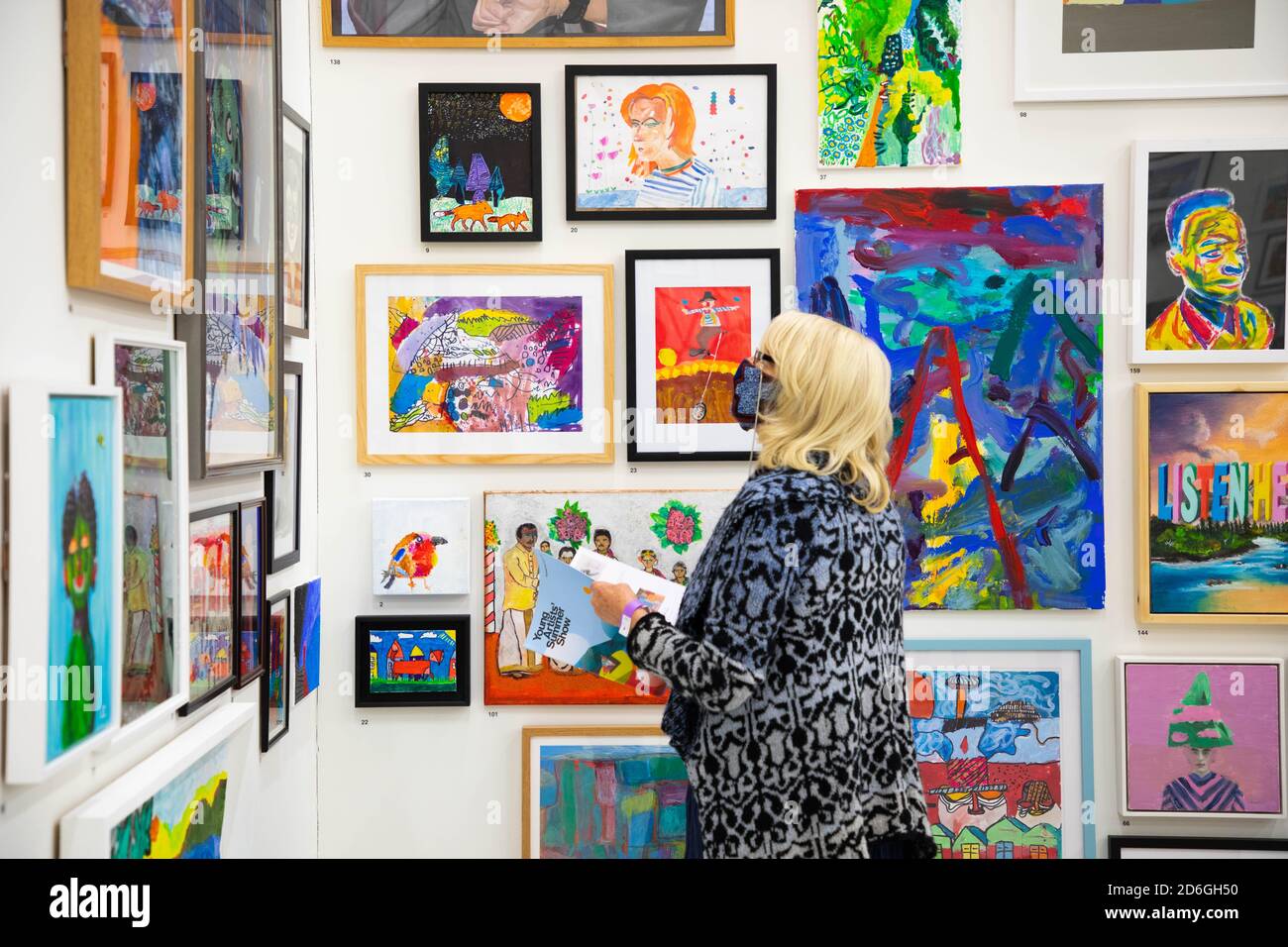 EDITORIAL USE ONLY Young artists and visitors view works at the opening ...