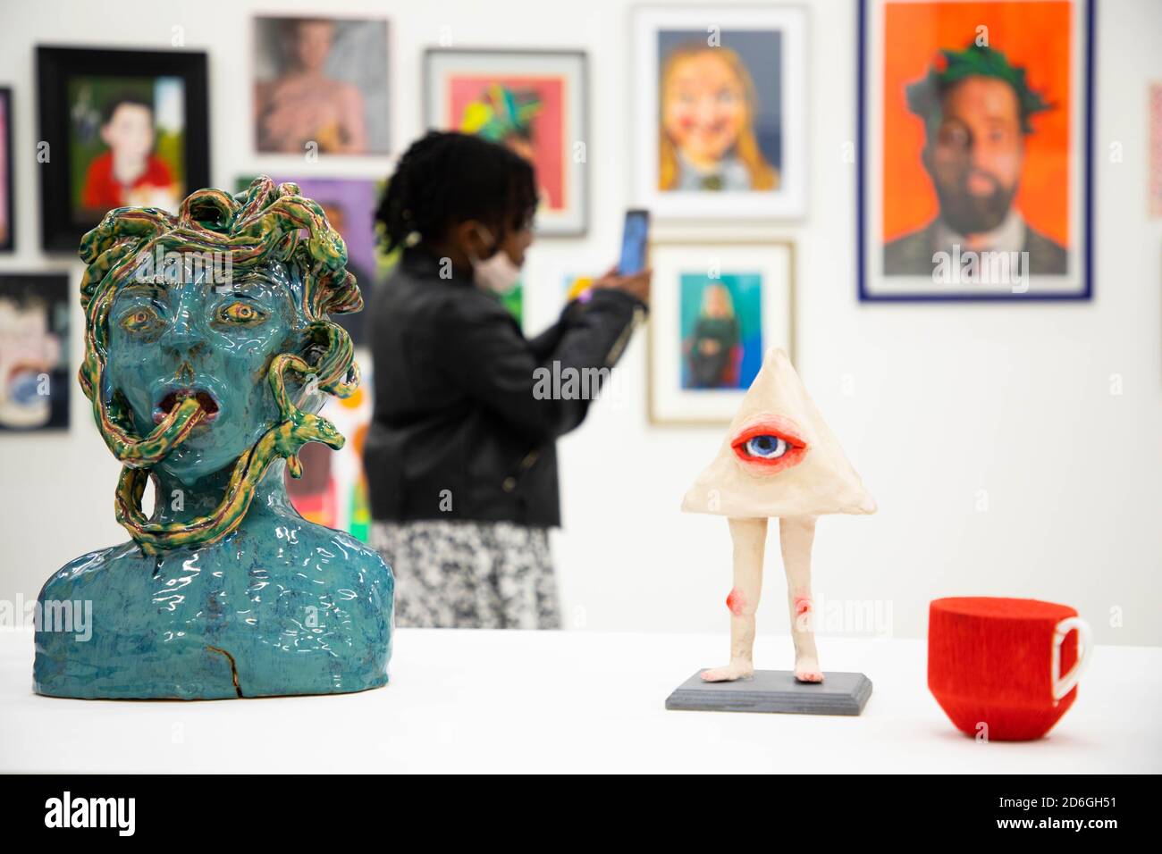Young artists and visitors view works at the opening of the Young ...