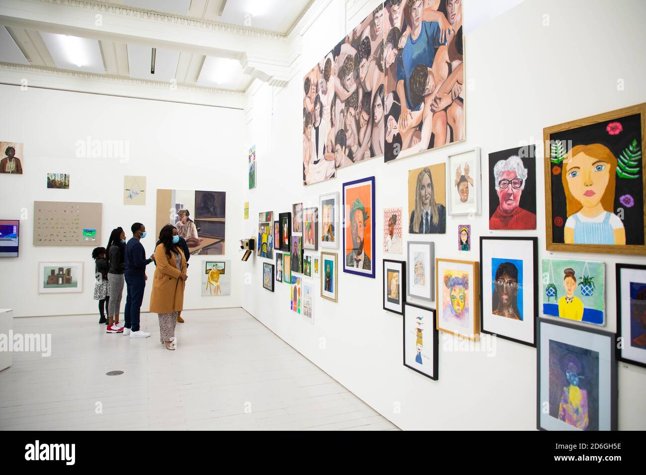 Young artists and visitors view works at the opening of the Young ...