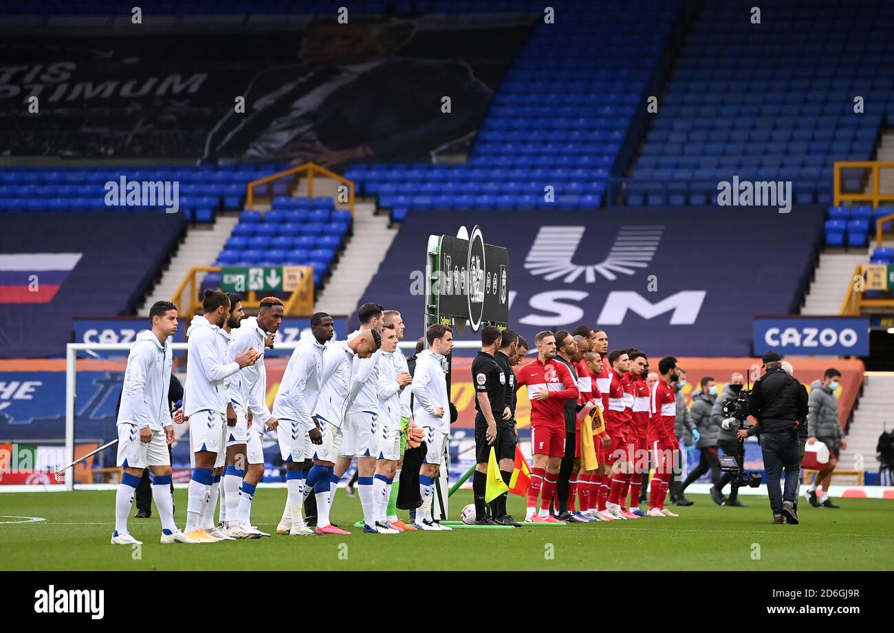 Everton and Liverpool players line up before the Premier League match at Goodison Park, Liverpool. Stock Photo