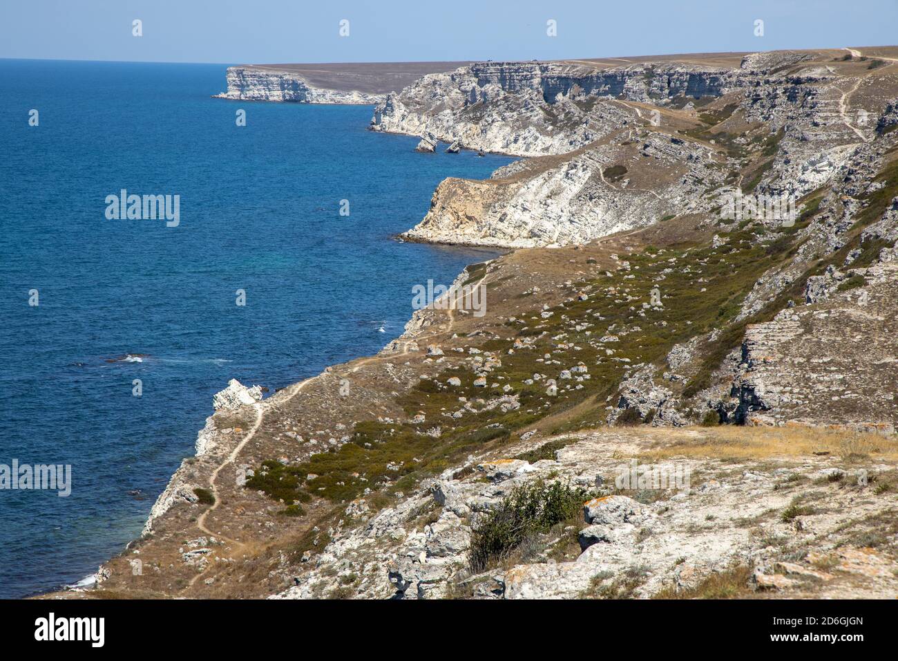 Scintillate sea surface and evening summer rocky coastline ('Novyj Svit' reserve, 'Rhinoceros' cape, Crimea, Ukraine). Six shots stitch image. Stock Photo