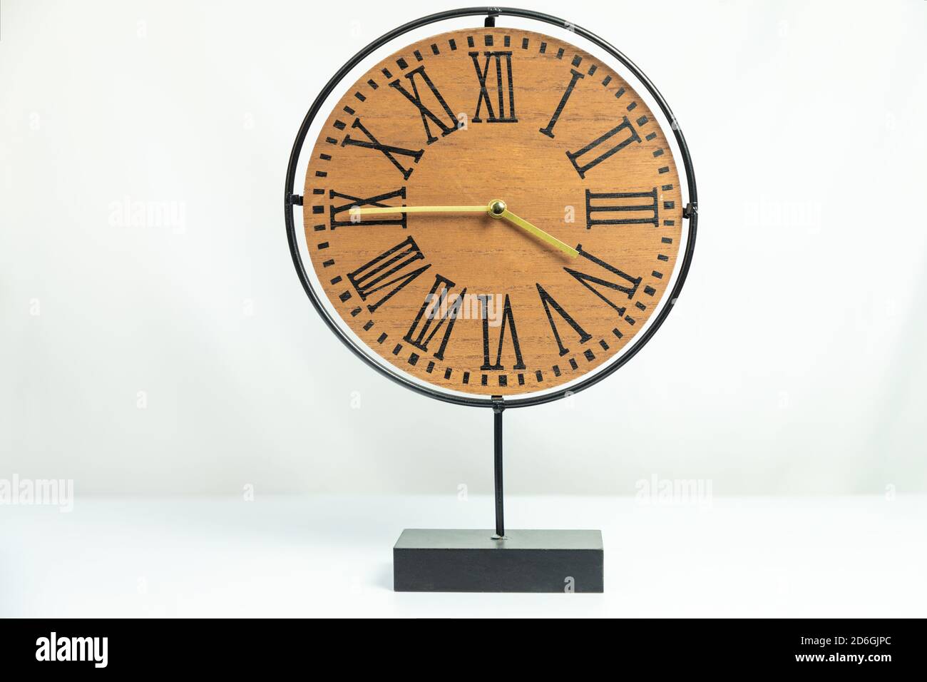 Wood table clock isolated white background Stock Photo - Alamy