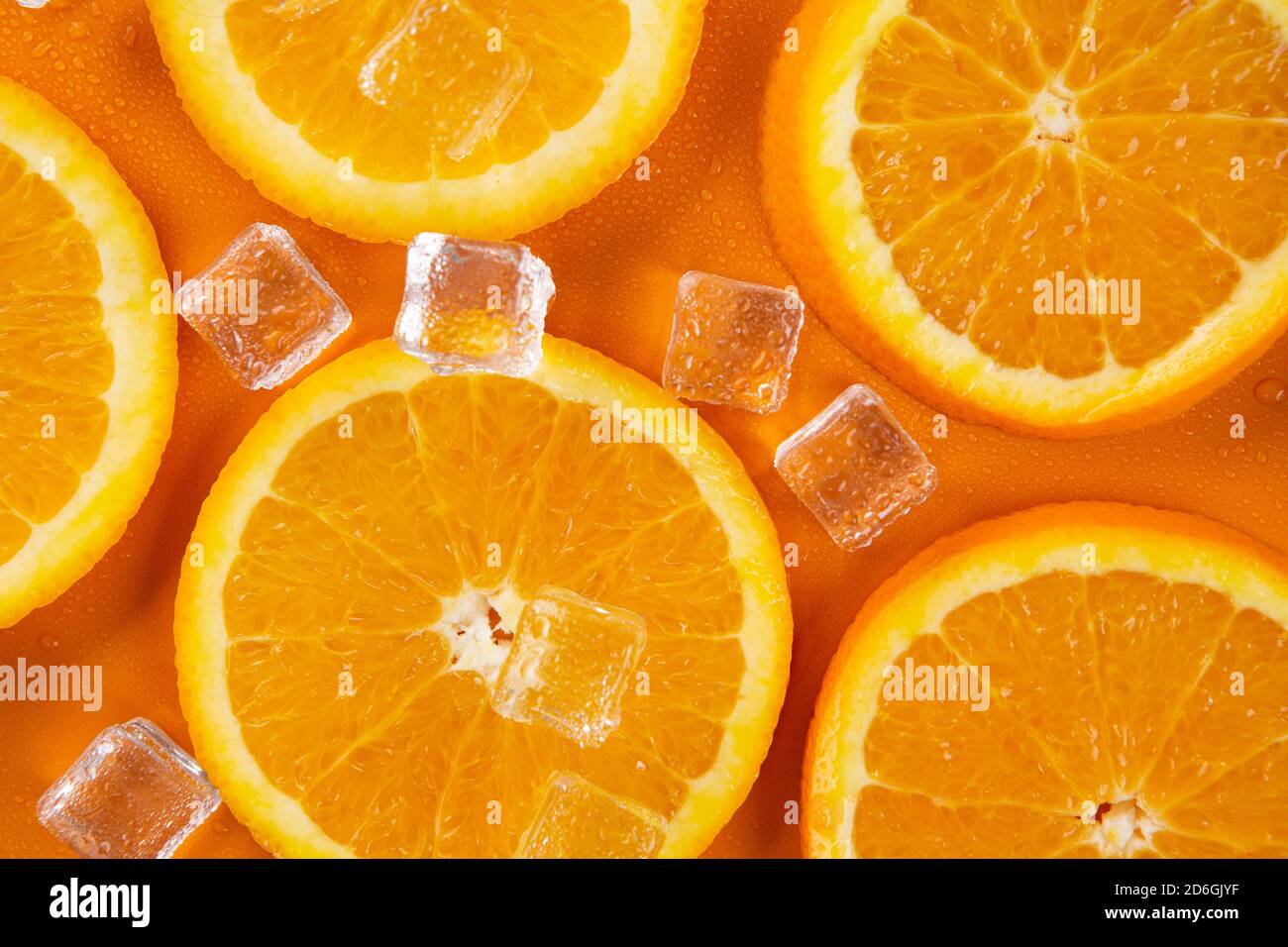 orange slices on a orange background Stock Photo