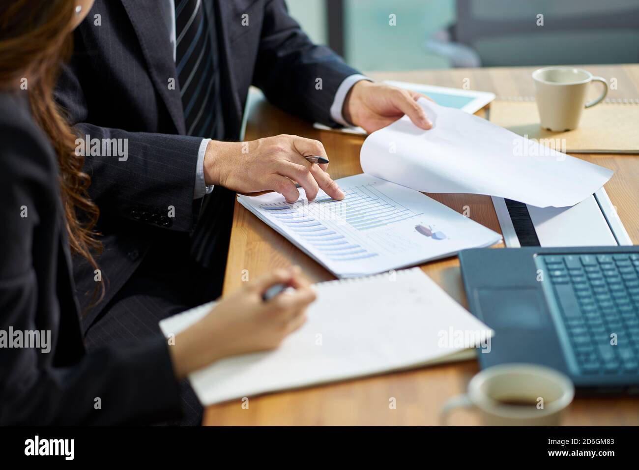 asian corporate executives working together reviewing business in office Stock Photo