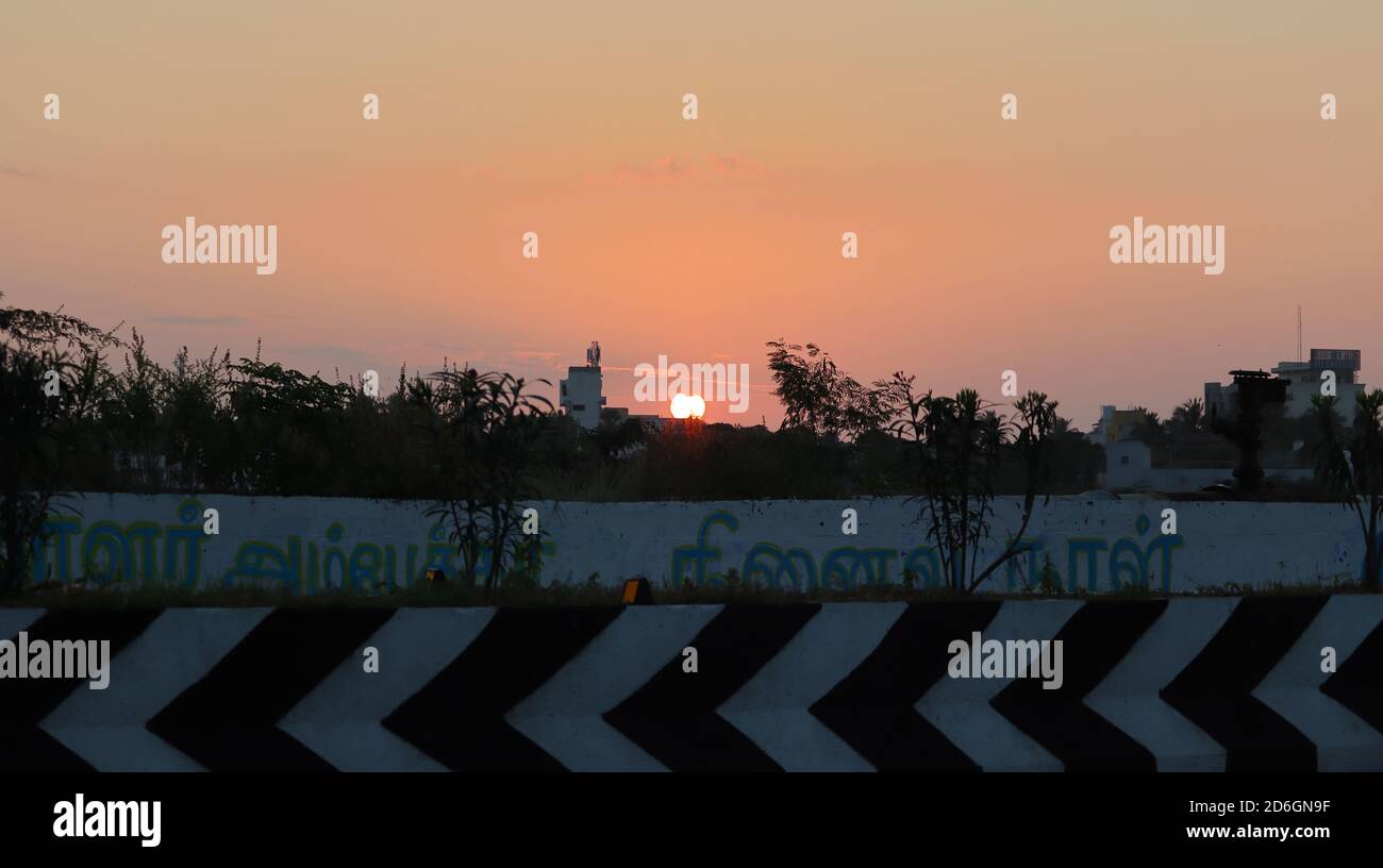 Sunrise through urban area in India Stock Photo