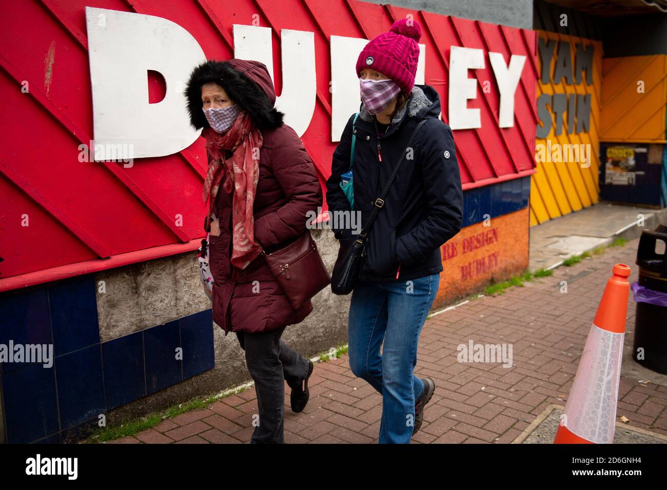 Shoppers wearing protective face masks walk along High Street, Dudley