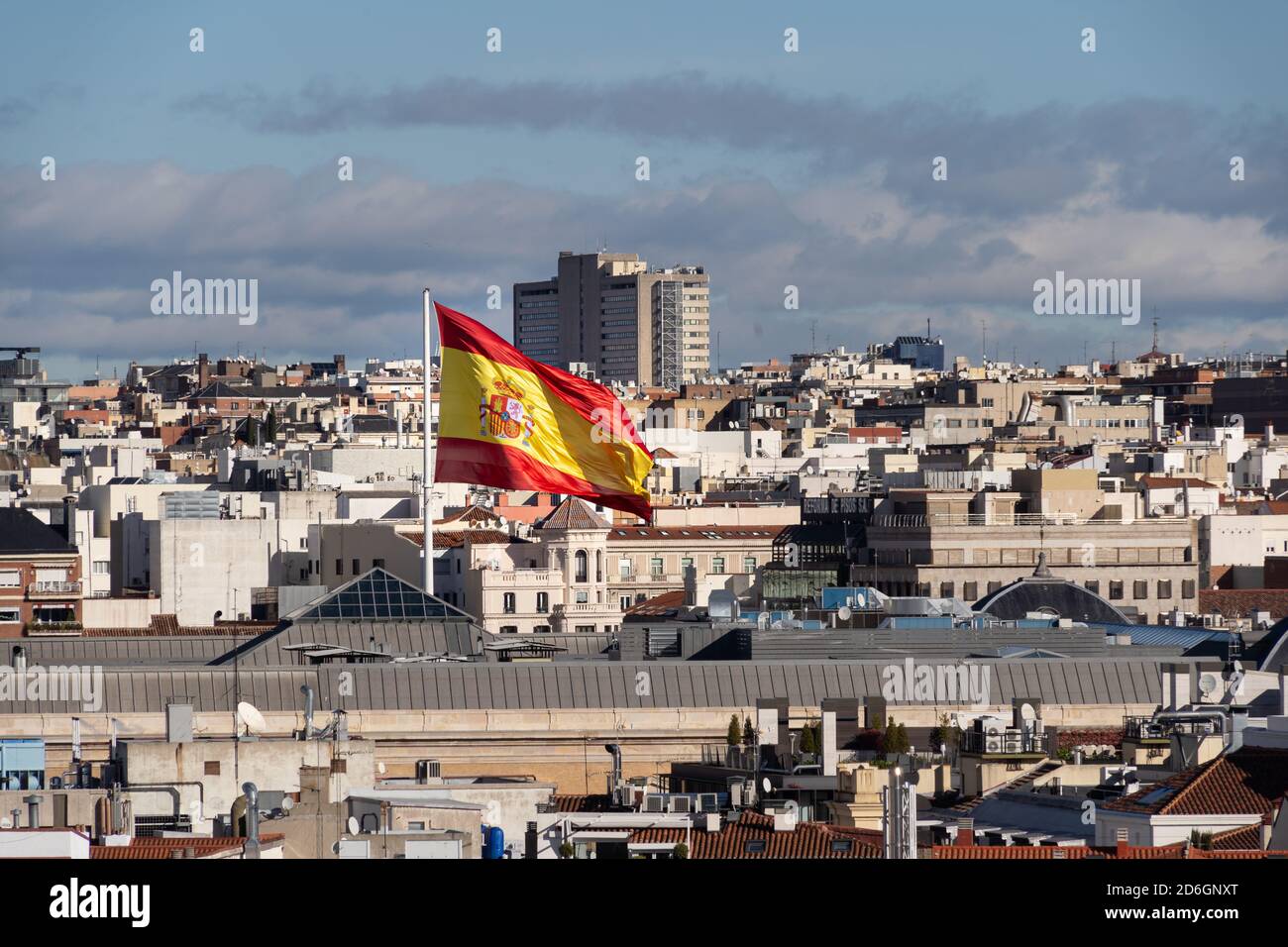 Giant spanish waving flag over the Madrid cityscape Stock Photo