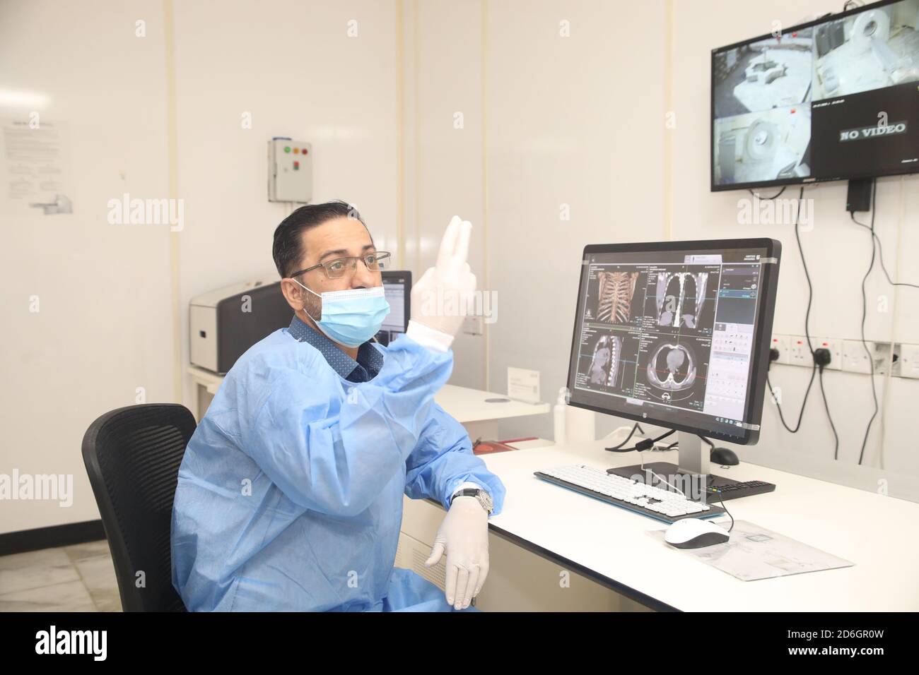Baghdad. 17th Oct, 2020. Dr. Mohammed Abdul-Hussein examines lung images at al-Shifaa Center in Baghdad, Iraq, Oct. 12, 2020. In a specialized COVID-19 hospital in Iraqi capital of Baghdad, a Chinese-donated CT scan, mobile X-ray equipment, and other medical supplies are saving lives in the front-line battle against the COVID-19 pandemic. Already 400 patients have benefited from the important medical donation. TO GO WITH 'Spotlight: Chinese-donated CT scan, mobile X-ray save lives in specialized COVID-19 hospital in Iraq' Credit: Xinhua/Alamy Live News Stock Photo