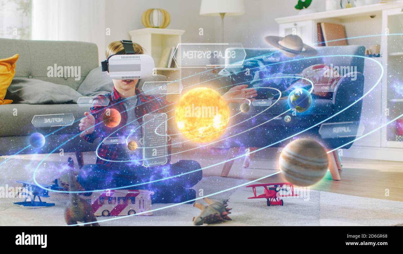 Smart Little Boy Wearing Virtual Reality Headset And Looking At Our Digitally Generated Solar System With Sun And Planets Space Exploration With Ar Stock Photo Alamy