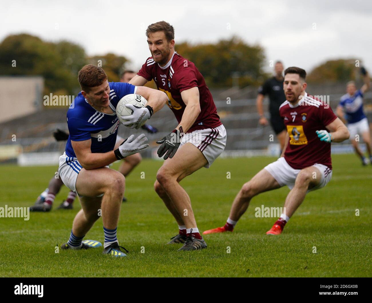 17th October 2020; TEG Cusack Park, Mullingar, Westmeath, Ireland; Allianz Football Division 2 Gaelic Football, Westmeath versus Laois; Evan O'Carroll (Laois) holds on to the ball under pressure from Kevin Maguire (Westmeath) Stock Photo