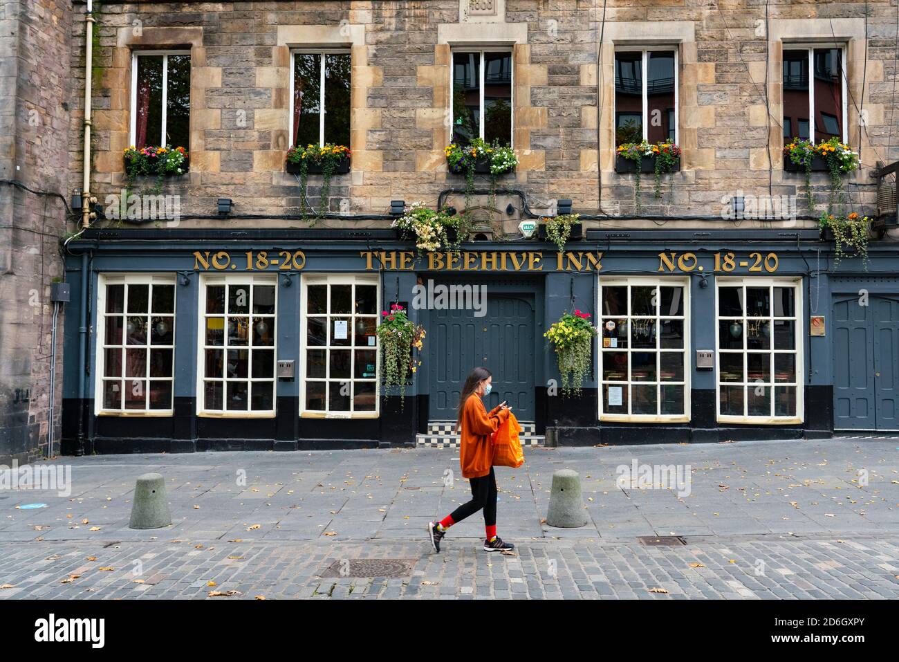 Edinburgh, Scotland, UK. 17 October 2020. Saturday afternoon in Edinburgh city centre during 16 day circuit breaker lockdown and bars are closed but cafes remain open. Streets in the Old town are very quiet and reminiscent of the eerie emptiness seen during the full lockdown earlier this year. The Beehive Inn is closed in The Grassmarket. Iain Masterton/Alamy Live News Stock Photo