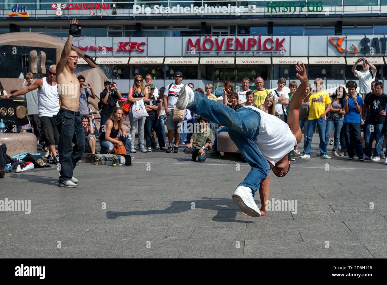 A rap dancer entertains a crowd gathered in a park in central Berlin in ...
