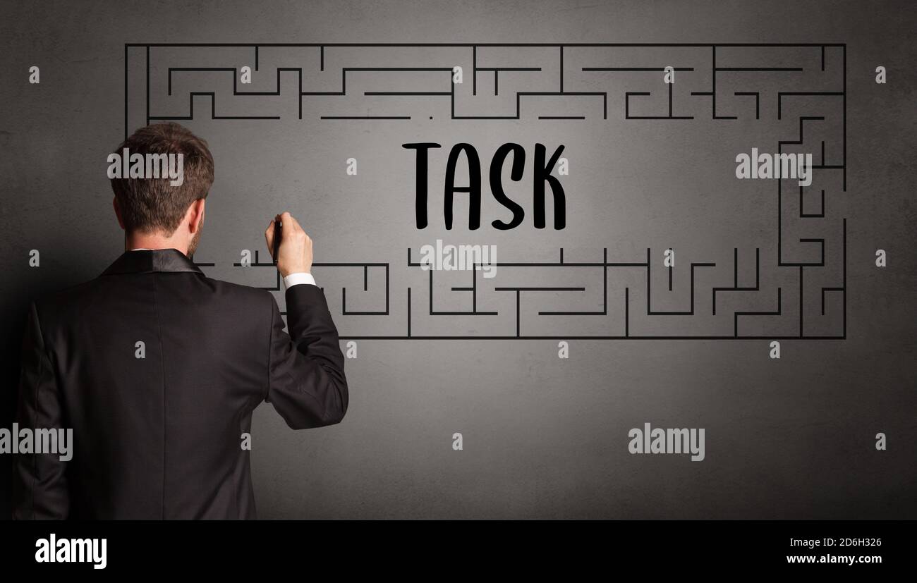 businessman drawing maze with TASK inscription, business education ...