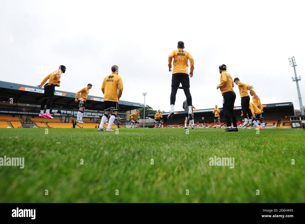 Port Vale players warm up before the Sky Bet League Two match at Vale Park, Stoke-on-Trent. Stock Photo