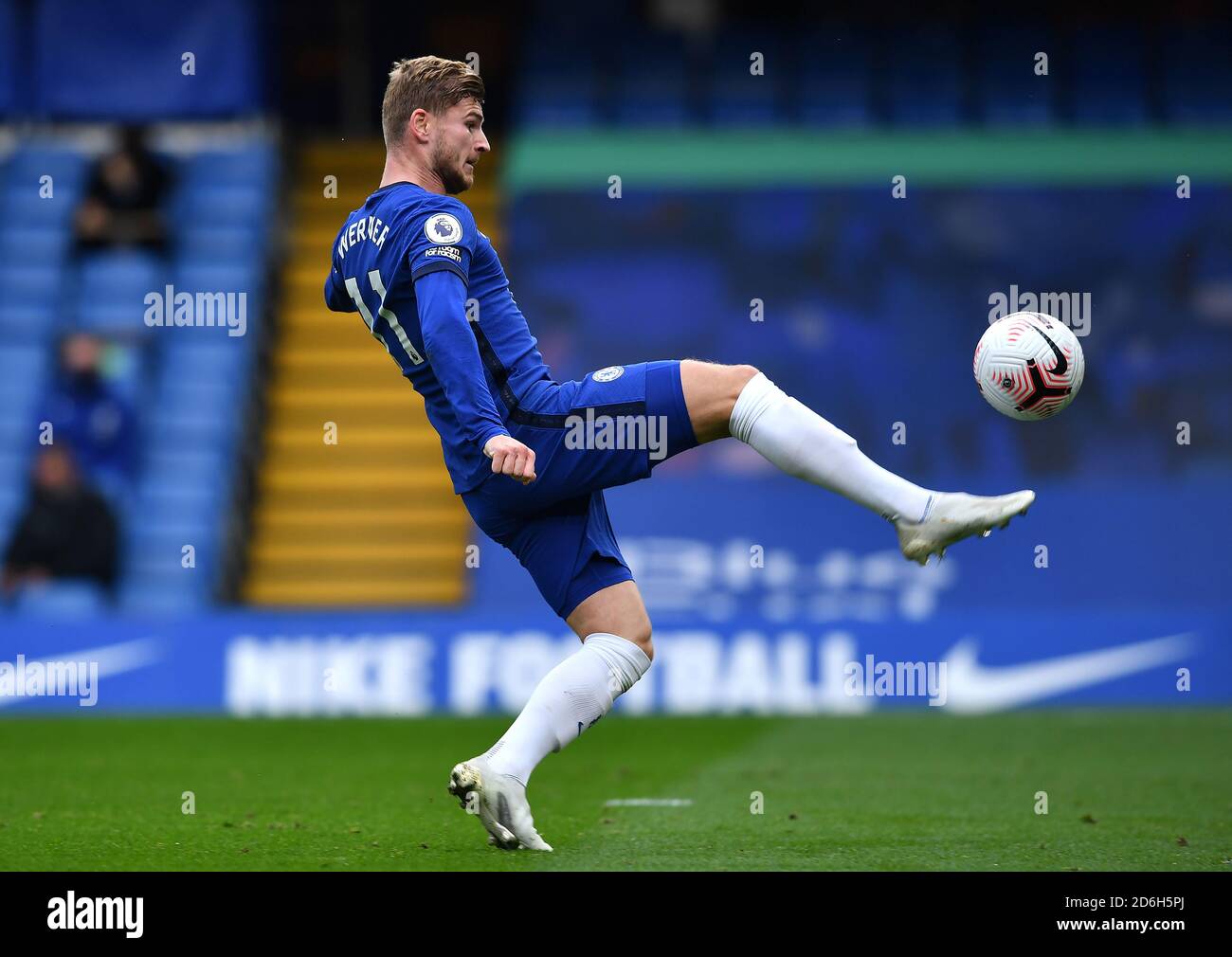 Chelsea's Timo Werner lobs the goalkeeper prior to scoring his side's second goal of the game during the Premier League match at Stamford Bridge, London. Stock Photo