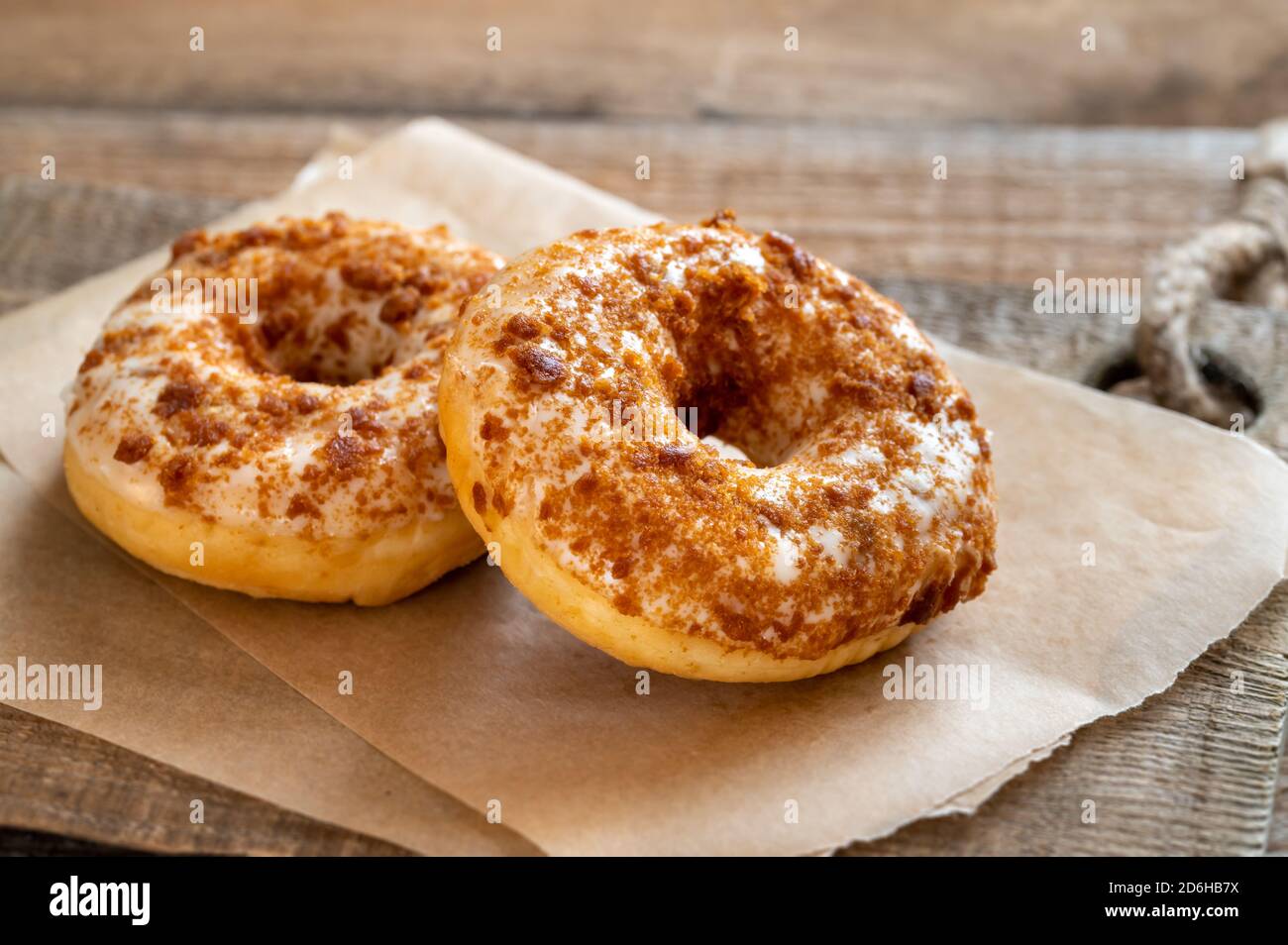 Two donuts on the wooden board Stock Photo