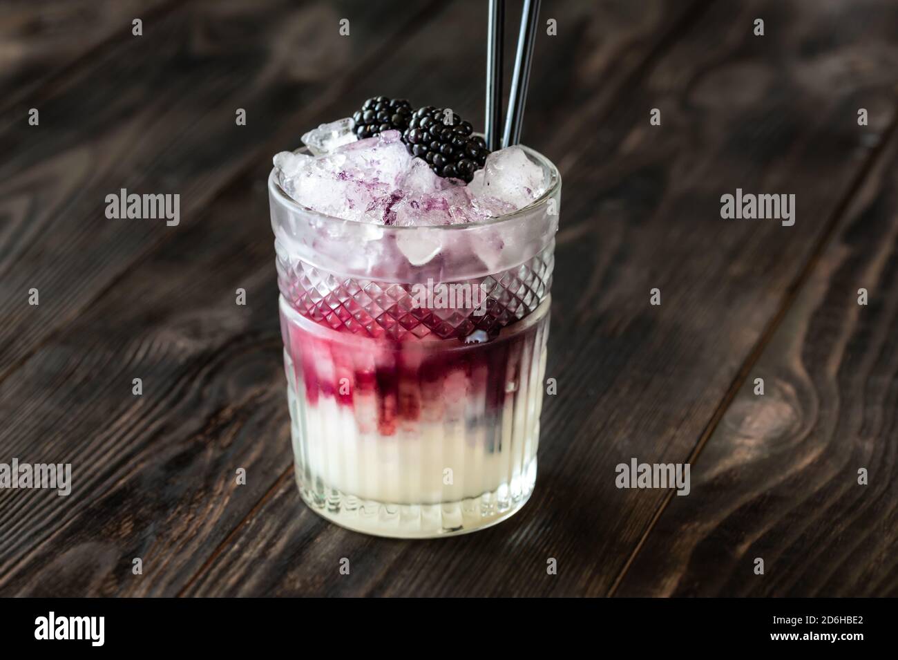 Glass of Bramble cocktail made of gin, lemon juice, sugar sypup and