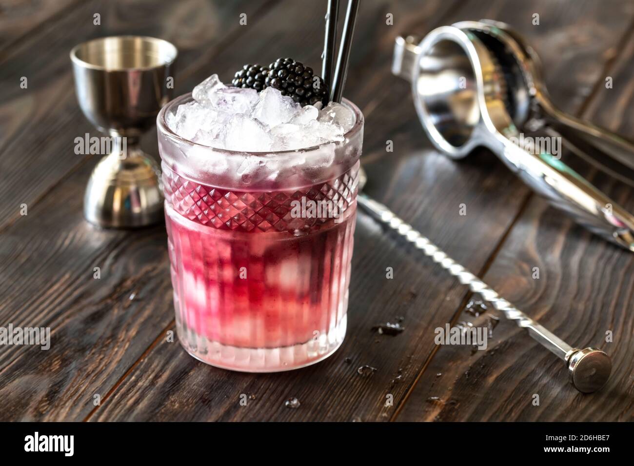 Glass of Bramble cocktail made of gin, lemon juice, sugar sypup and