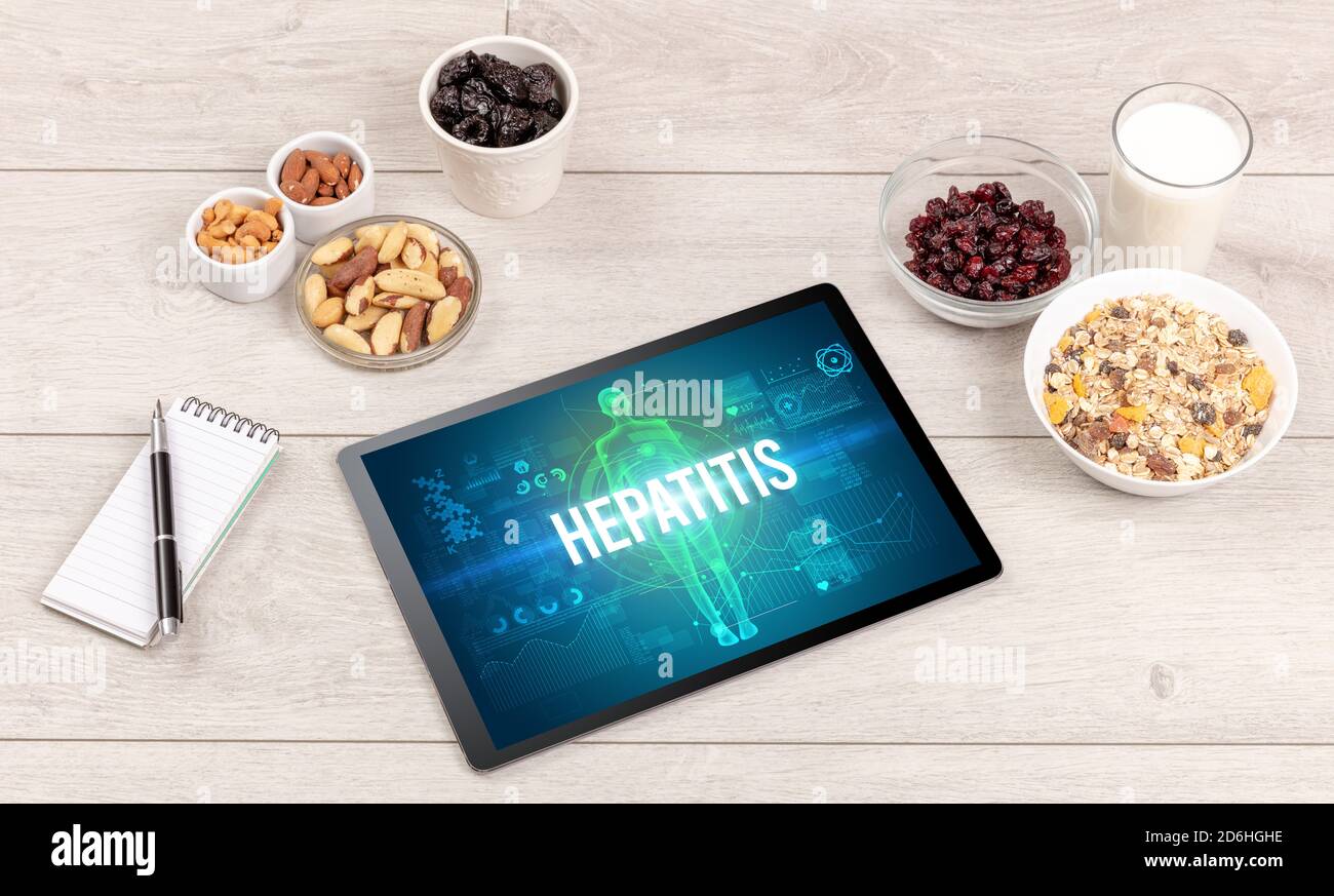 HEPATITIS concept in tablet with fruits, top view Stock Photo Alamy