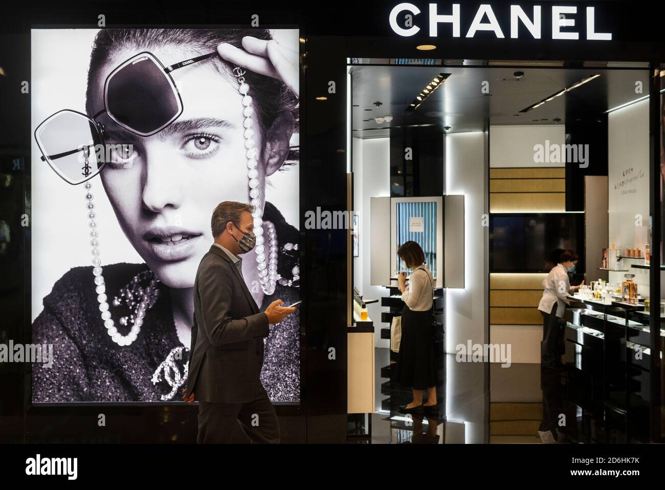 Shoppers walk past the French fashion brand Chevignon store in Hong Kong's  Tung Chung district. (Photo by Budrul Chukrut / SOPA Images/Sipa USA Stock  Photo - Alamy