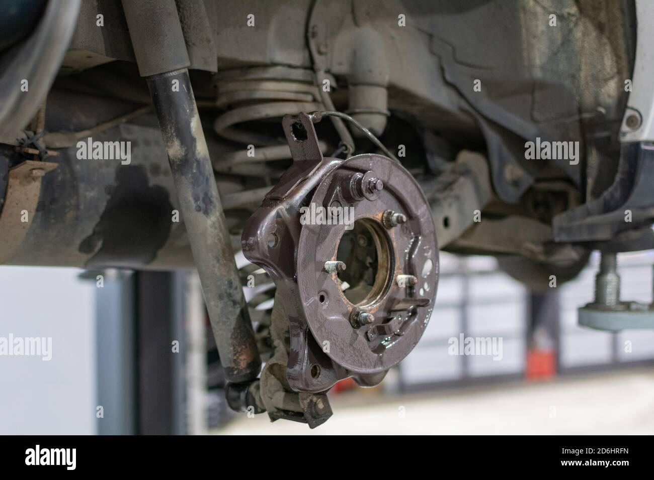 Car in service. Detail of the wheel hub assembly on automobile. Stock Photo