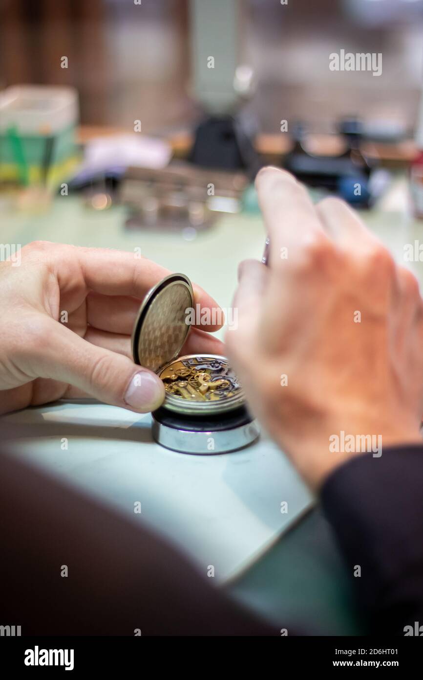 Details of watches and mechanisms for reparation, restoration and maintenance. mas hands Stock Photo