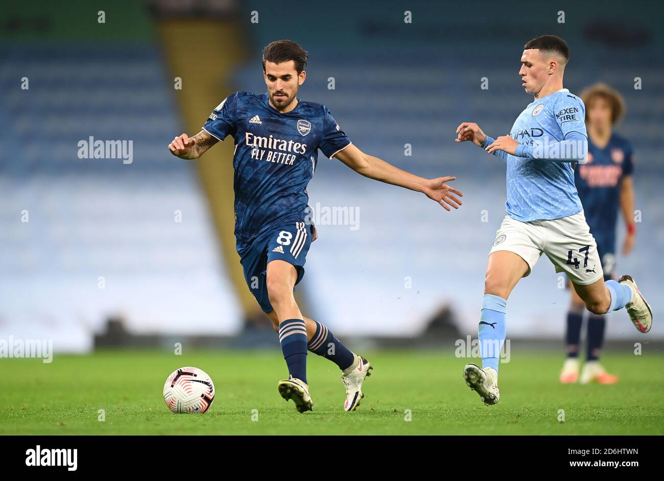 Arsenal's Dani Ceballos (left) and Manchester City's Phil Foden in action during the Premier League match at the Etihad Stadium, Manchester. Stock Photo