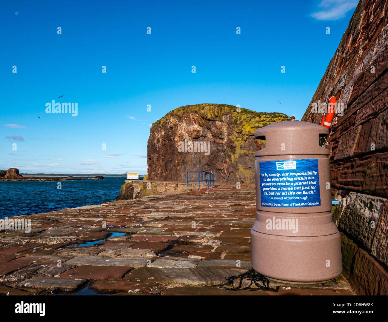 Environmental quote on litter bin by Sir David Attenborough, Dunbar Harbour quayside, East Lothian, Scotland, UK Stock Photo