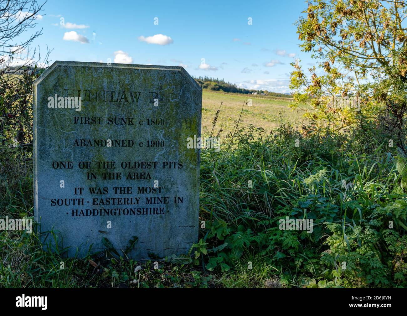 Memorial stone for Huntlaw Pit coal mine on Pencaitland railway walk, East Lothian, Scotland, UK Stock Photo