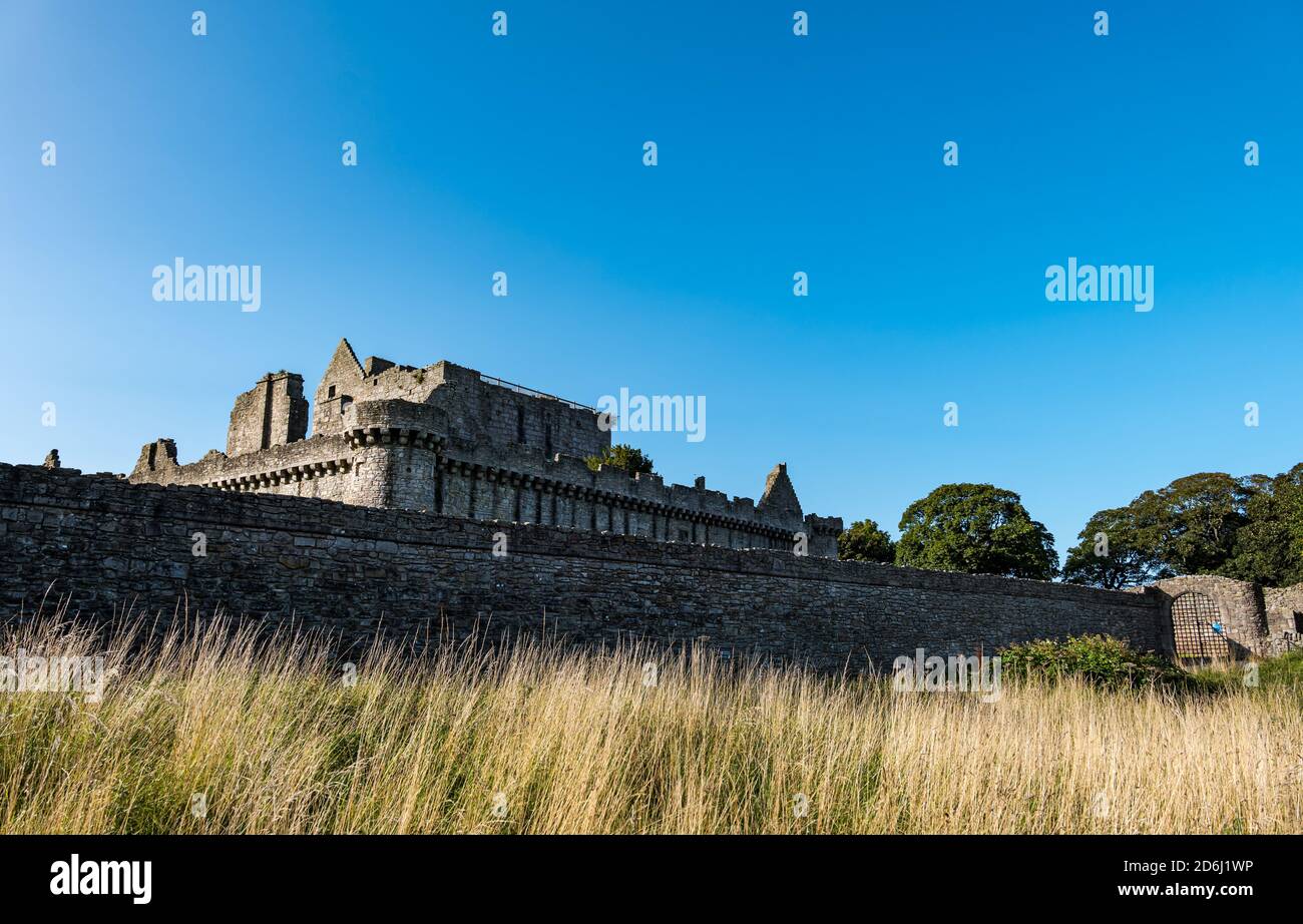 Craigmillar Castle walls on sunny day with blue sky, Edinburgh, Scotland, UK Stock Photo