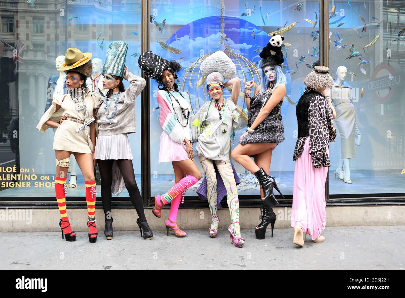 Models showcase Pierre Garroudi collection during the flash mob fashion show in Kightsbridge. Stock Photo