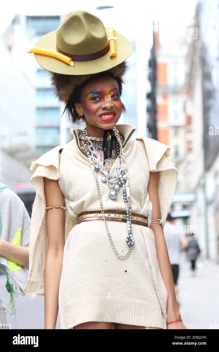 A model showcases Pierre Garroudi collection during the flash mob fashion show in Kightsbridge. Stock Photo