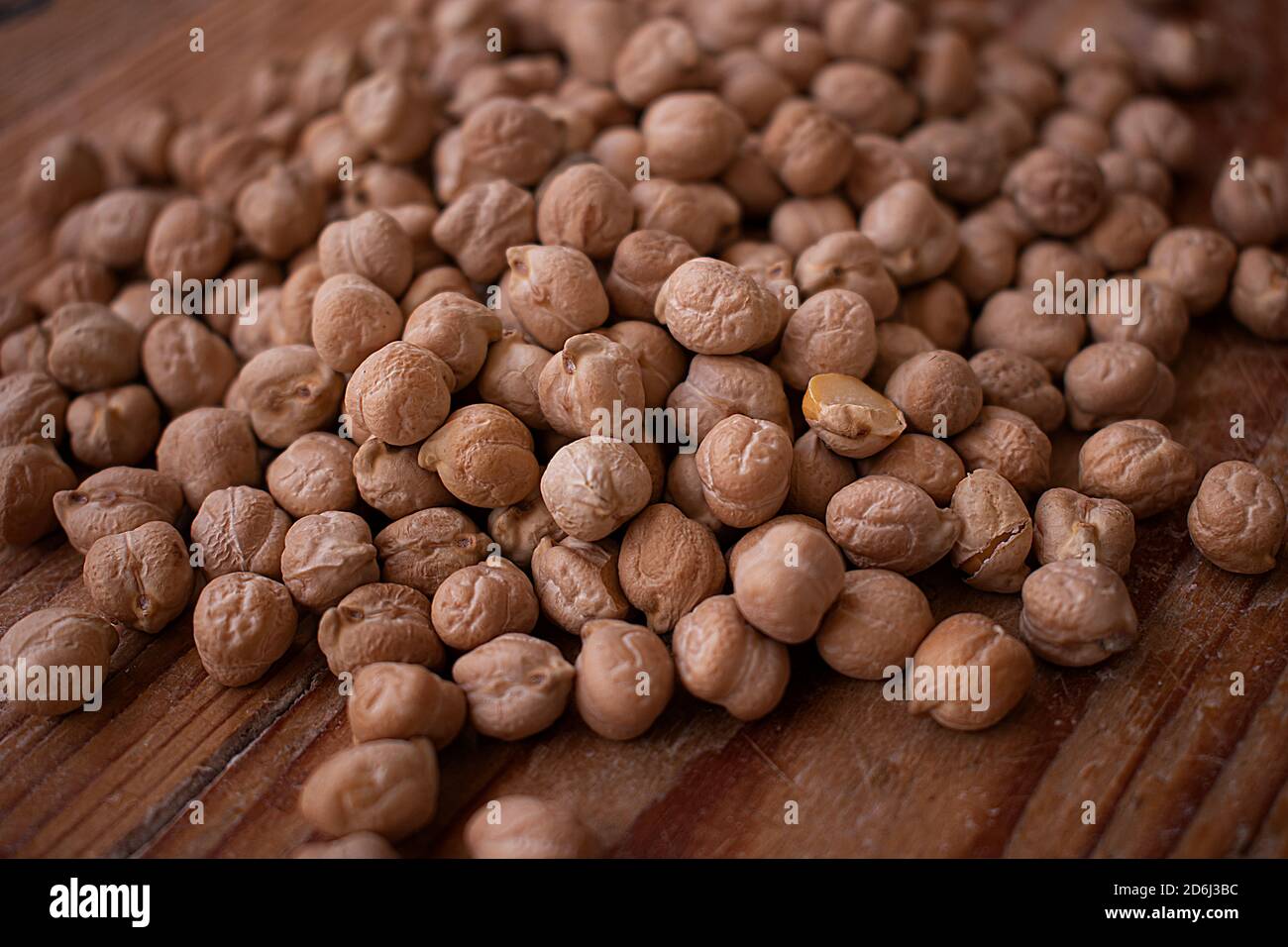 Chickpea grains on wooden background Stock Photo Alamy
