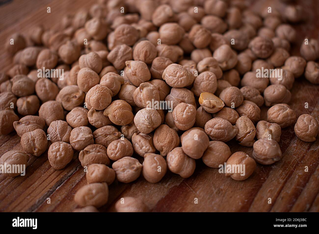 Chickpea grains on wooden background Stock Photo