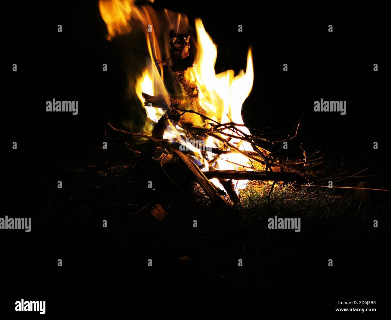 A bonfire burning at night. Fire flames in the dark Stock Photo - Alamy