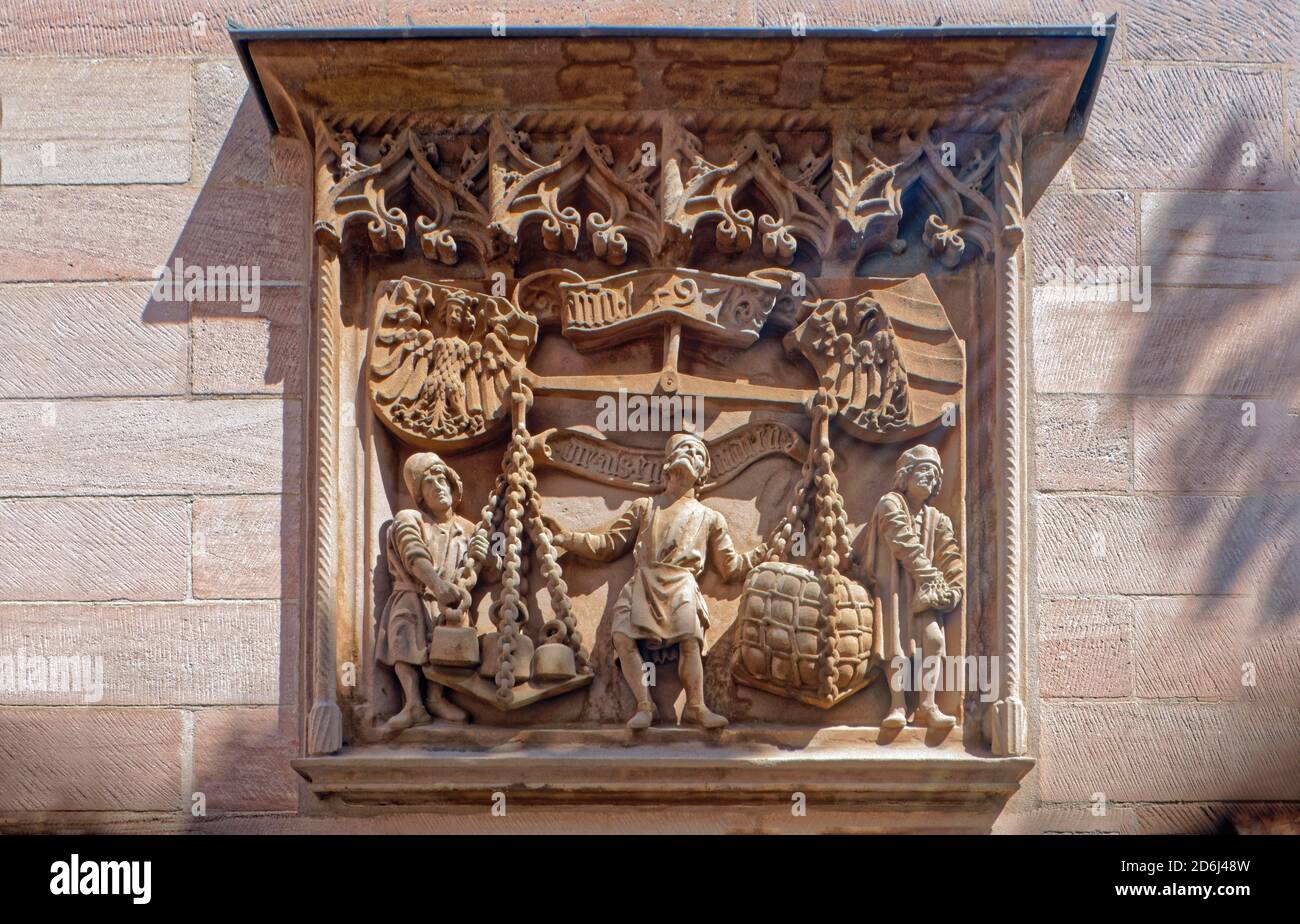 Replica of the Waagrelief by Adam Kraft, 1497, former Waaghaus, shows the scales as a symbol of trade and a symbol of fair compensation, original in Stock Photo